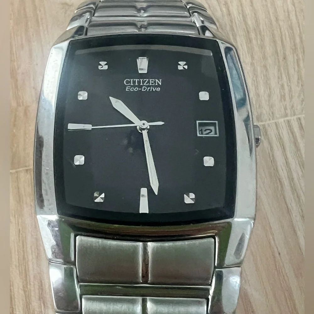 Citizen eco-drive rectangular black dial silver tone solar dress watch